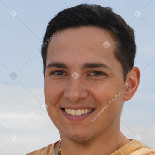 Joyful white young-adult male with short  brown hair and brown eyes