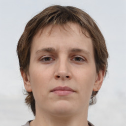 Neutral white young-adult female with short  brown hair and brown eyes