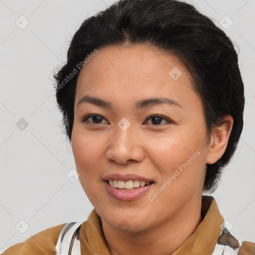 Joyful latino young-adult female with short  brown hair and brown eyes