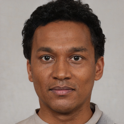 Neutral latino adult male with short  black hair and brown eyes
