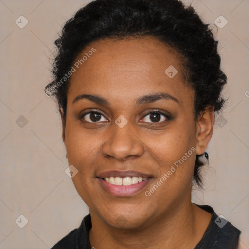 Joyful black young-adult female with long  brown hair and brown eyes