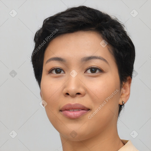 Joyful asian young-adult female with short  black hair and brown eyes