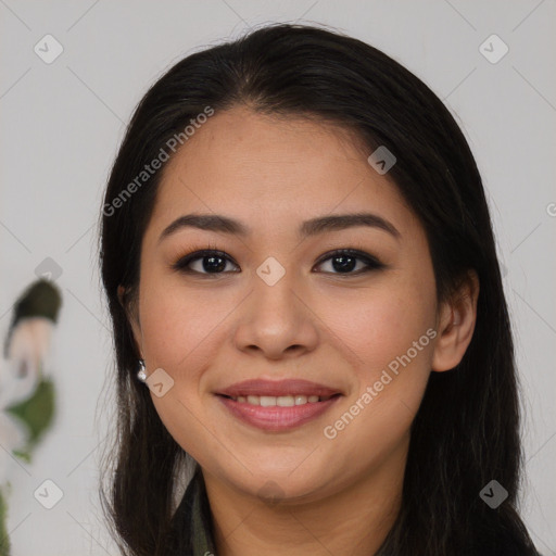 Joyful latino young-adult female with long  brown hair and brown eyes