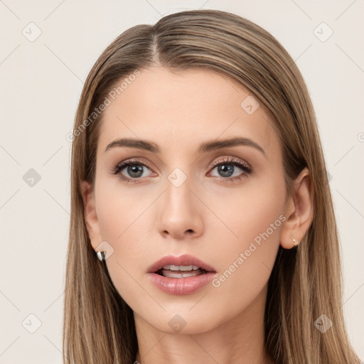 Neutral white young-adult female with long  brown hair and brown eyes