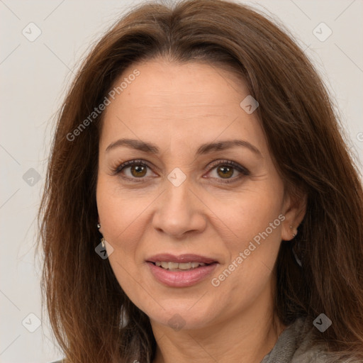 Joyful white adult female with long  brown hair and brown eyes