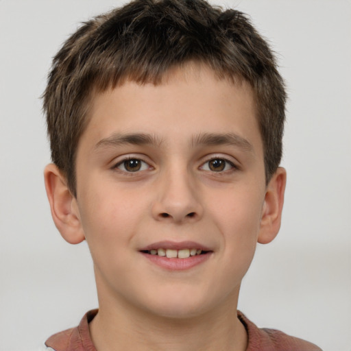 Joyful white child male with short  brown hair and brown eyes