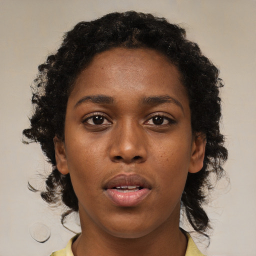Neutral black young-adult female with medium  brown hair and brown eyes