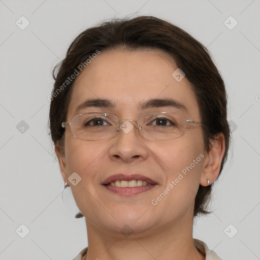 Joyful white adult female with medium  brown hair and brown eyes