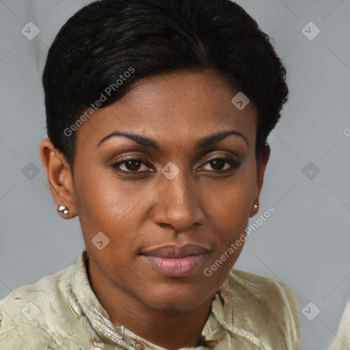 Joyful black young-adult female with short  brown hair and brown eyes