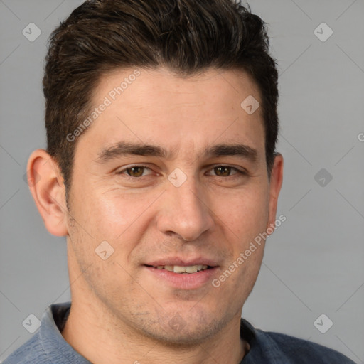 Joyful white adult male with short  brown hair and brown eyes