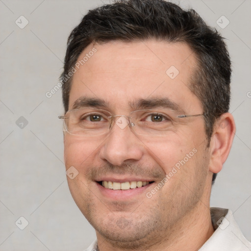 Joyful white adult male with short  brown hair and brown eyes