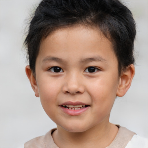 Joyful white child male with short  brown hair and brown eyes
