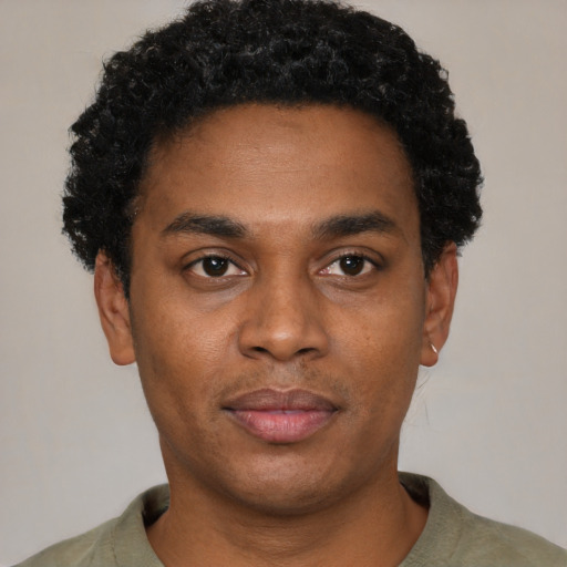 Neutral black young-adult male with short  black hair and brown eyes