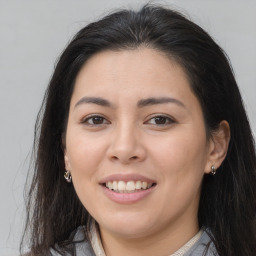 Joyful asian young-adult female with long  brown hair and brown eyes