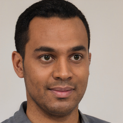 Neutral black young-adult male with short  black hair and brown eyes