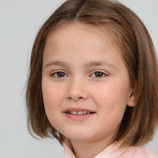 Joyful white child female with medium  brown hair and brown eyes