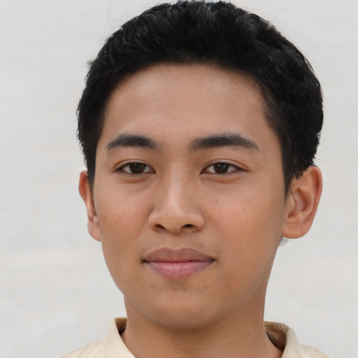 Joyful asian young-adult male with short  brown hair and brown eyes