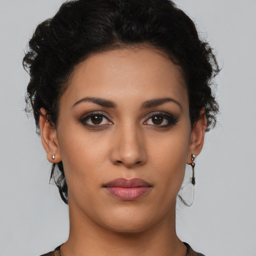 Joyful latino young-adult female with short  brown hair and brown eyes