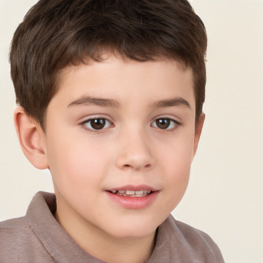 Joyful white child male with short  brown hair and brown eyes