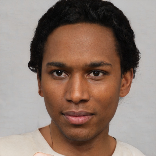 Neutral black young-adult male with short  black hair and brown eyes