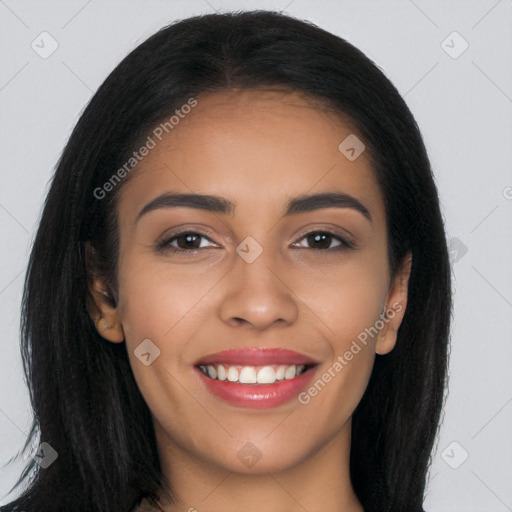 Joyful latino young-adult female with long  brown hair and brown eyes