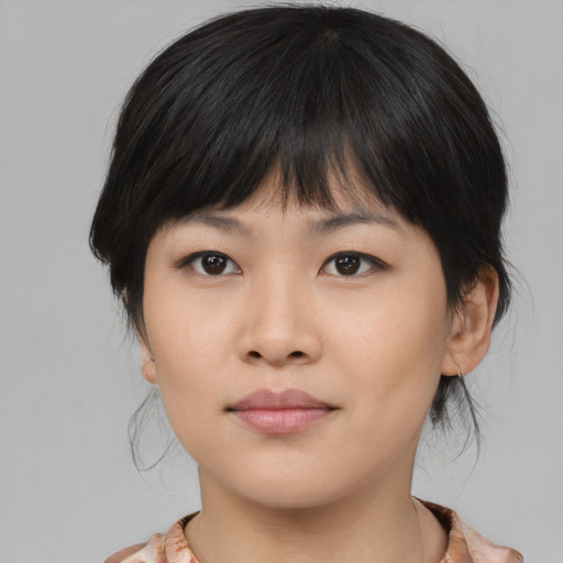 Neutral asian young-adult female with medium  brown hair and brown eyes