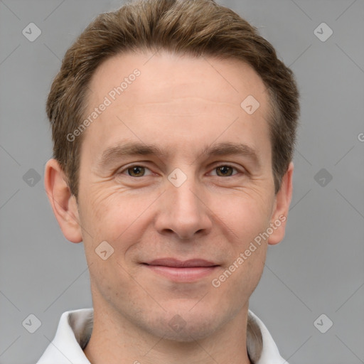 Joyful white adult male with short  brown hair and grey eyes