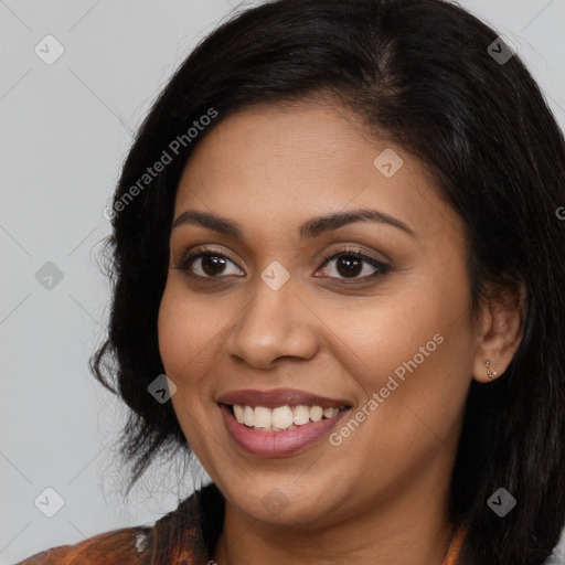 Joyful latino young-adult female with long  brown hair and brown eyes