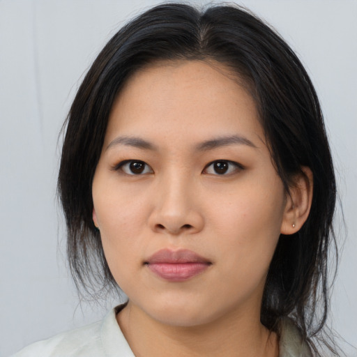 Neutral asian young-adult female with medium  brown hair and brown eyes