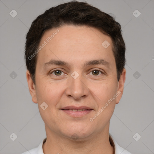 Joyful white adult male with short  brown hair and brown eyes