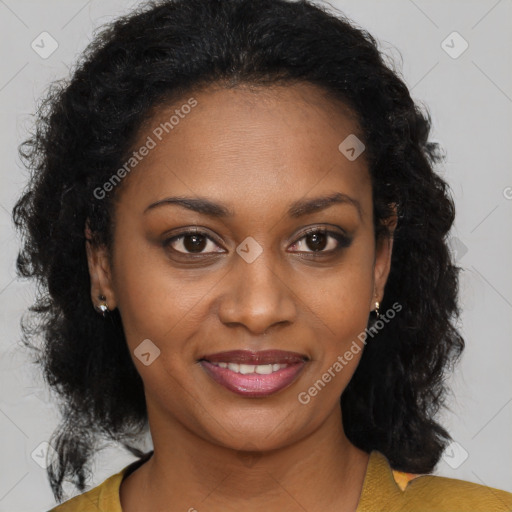 Joyful black young-adult female with long  brown hair and brown eyes