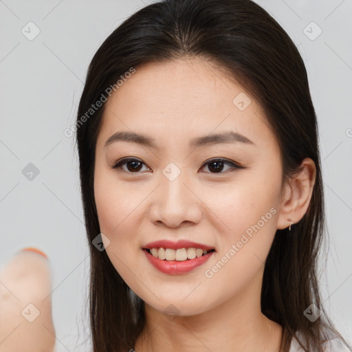 Joyful white young-adult female with long  brown hair and brown eyes