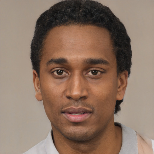 Neutral black young-adult male with short  black hair and brown eyes