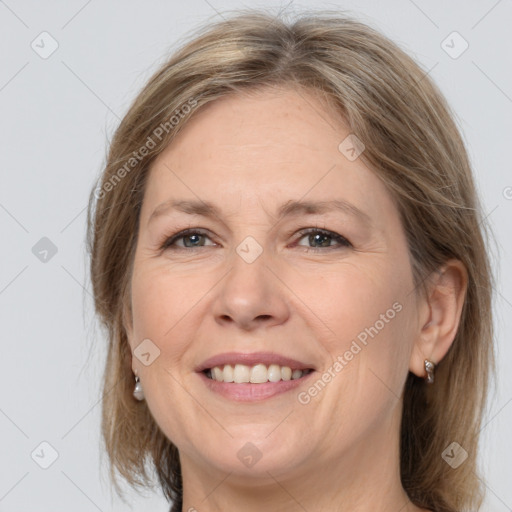 Joyful white adult female with medium  brown hair and brown eyes