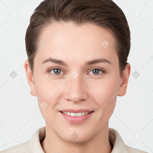 Joyful white young-adult female with short  brown hair and grey eyes