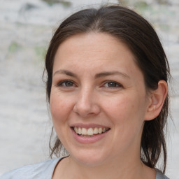 Joyful white young-adult female with medium  brown hair and brown eyes