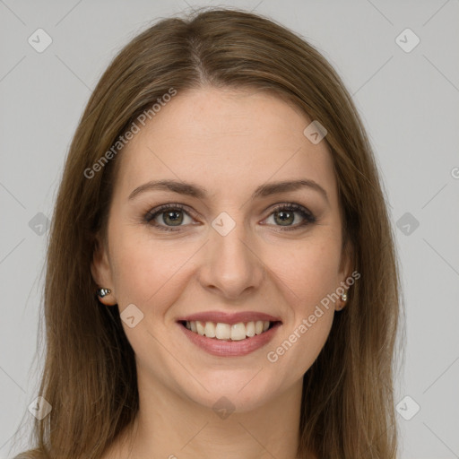 Joyful white young-adult female with long  brown hair and green eyes