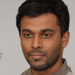 Neutral white young-adult male with short  black hair and brown eyes
