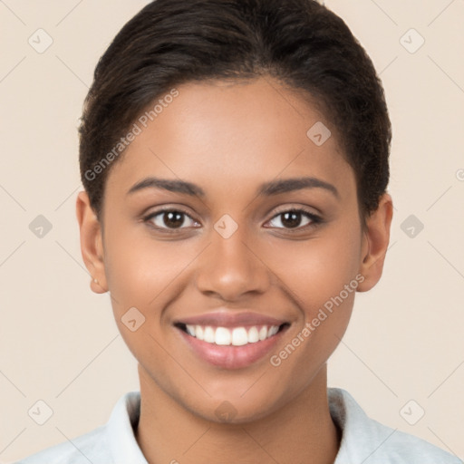 Joyful latino young-adult female with short  brown hair and brown eyes