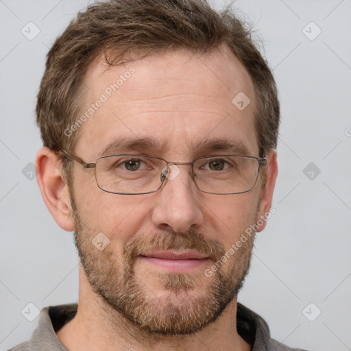 Joyful white adult male with short  brown hair and grey eyes