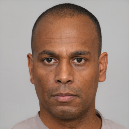 Neutral black adult male with short  black hair and brown eyes