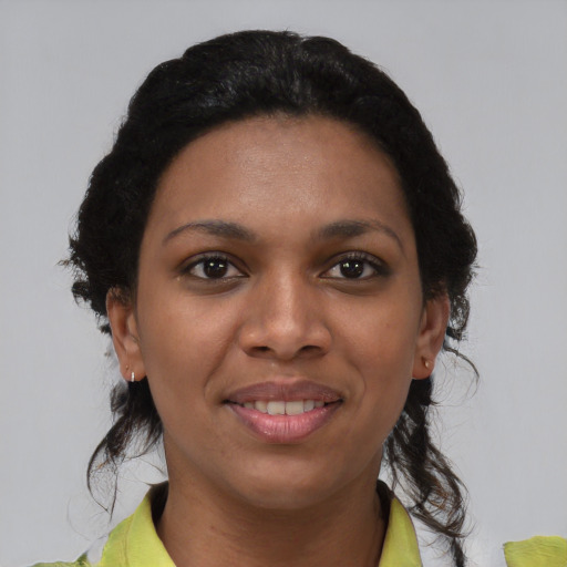 Joyful latino young-adult female with medium  black hair and brown eyes