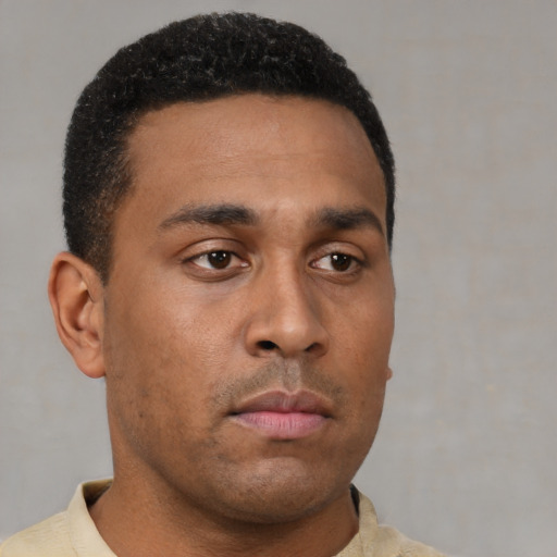 Neutral latino young-adult male with short  black hair and brown eyes