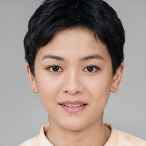Joyful asian young-adult female with short  black hair and brown eyes