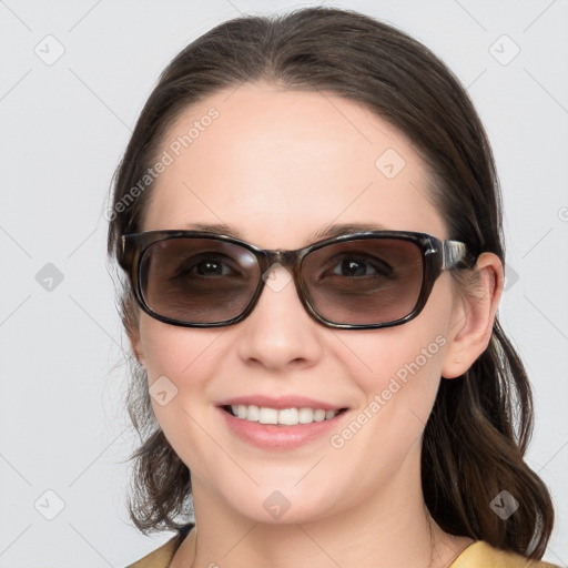 Joyful white young-adult female with medium  brown hair and blue eyes