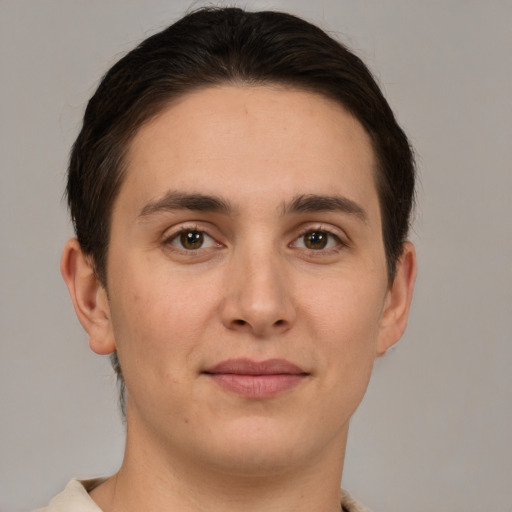 Joyful white young-adult male with short  brown hair and brown eyes