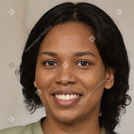 Joyful black young-adult female with medium  black hair and brown eyes