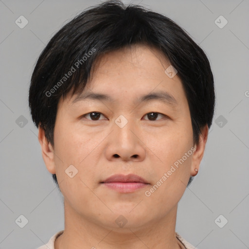 Neutral asian adult male with short  brown hair and brown eyes