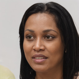 Joyful asian young-adult female with long  black hair and brown eyes