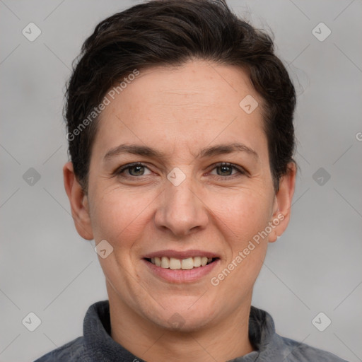 Joyful white adult female with short  brown hair and grey eyes